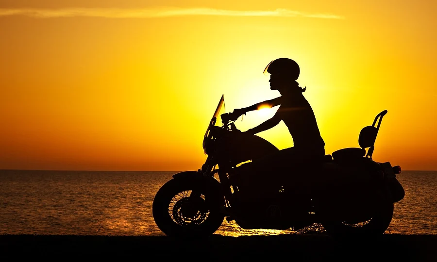 Biker riding during sunset