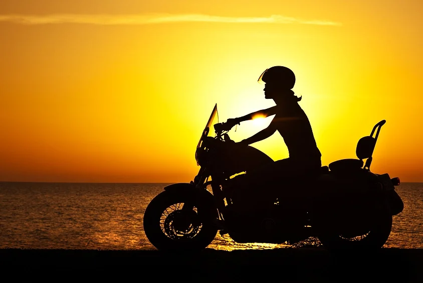 Biker riding during sunset